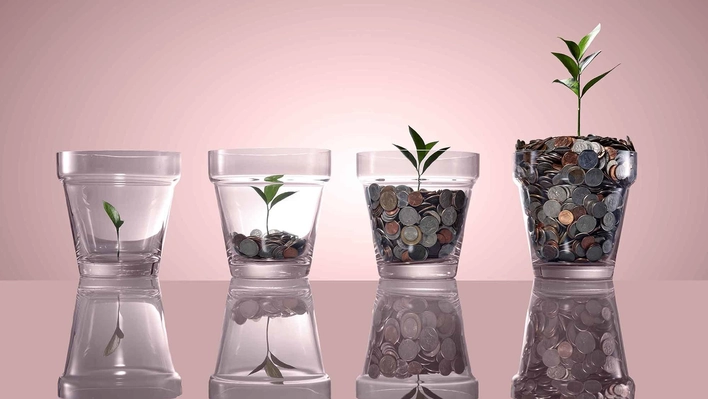 Glass flower pots hold coins